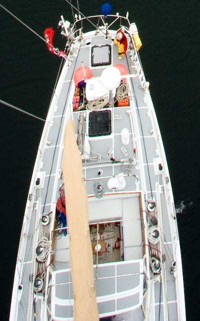 A view of the deck of aluminum sailboat Morgan's Cloud taken from the top of the mast, showing the Treadmaster deck covering