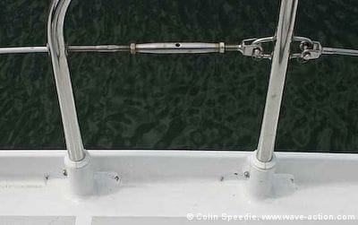 Stainless steel stanchions are isolated in plastic sockets to avoid corrosion on this aluminum OVNI 435