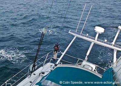 An OVNI 435 aluminum sailboat underway using a Windpilot self steering gear
