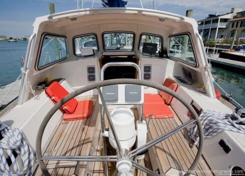 The sheltered and easy to work in cockpit. A huge locker to starboard swallows two full-sized mountain bikes and two Klepper folding Kayaks. I think that if Phyllis and I were building such a boat we would have gone for a fully enclosed wheel house, but that would have made the cockpit more cramped and impinged on the raised salon. As Michael said repeatedly during my tour. "Compromises, compromises, all boats are compromises".