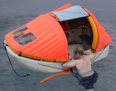 Portland Pudgy with exposure canopy and man in the water