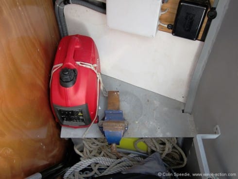 Instead of the standard arrangement of a head and shower compartment forward of the forecabin, we opted for a storage cabin with a small welded workbench. This a cavernous space and swallows up all of our spare sails, warps and anchors. The forward bulkhead is watertight. We have no diesel genset, and our little Honda petrol generator is a useful backup.