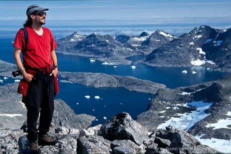 Man standing at top of mountain in SE Greenland Scanned With Provia Profile