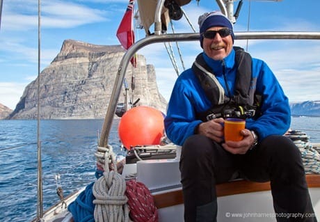 Sitting on aft cabin drinking coffee, West Greenland JHH5II-11338