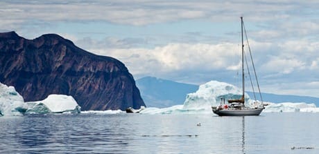 Sailboat in front of mountains and ice, West Greenland JHH5II-11446