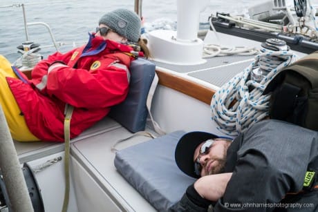 Drugged young people in the cockpit of a sailboat