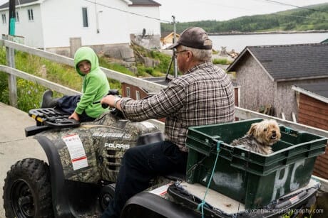 Granddad, grandson and granddog on an ATV in LaPoile, Newfoundland