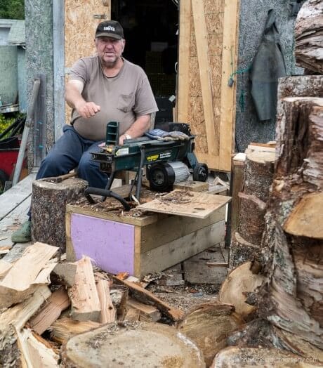 A man chopping kindling in LaPoile, Newfoundland