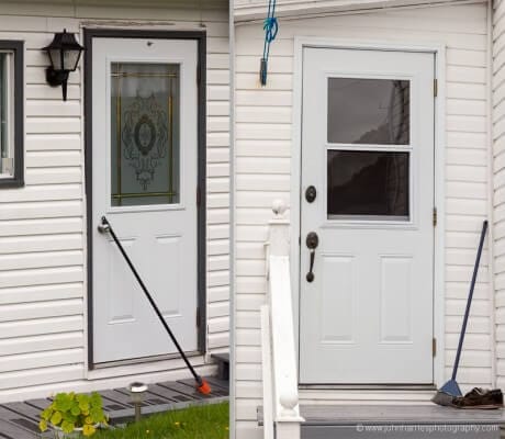Brooms on doorsteps in McCallum, Newfoundland, as a form of community communication