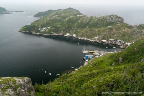 Sailboat Morgan's Cloud alongside the wharf in McCallum, Newfoundland, taken from high on cliff