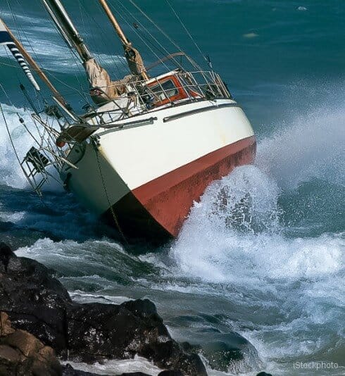Sailboat aground on the rocks yacht crash on the rocks