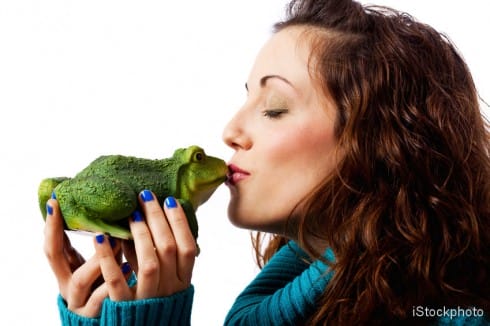 Beautiful woman kissing frog or is it the handsome prince? iStock_000012376242Small copy