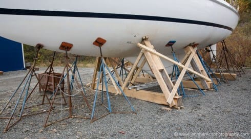 "Morgan's Cloud" as ready for a hurricane as we could make her in two days. Even this plethora of jackstands was not enough. Even though we were not able to finish it before the strike (aft supports not installed) is was the cradle that saved her, particularly the support in the way of the mast. Well worth the 0 it cost us!